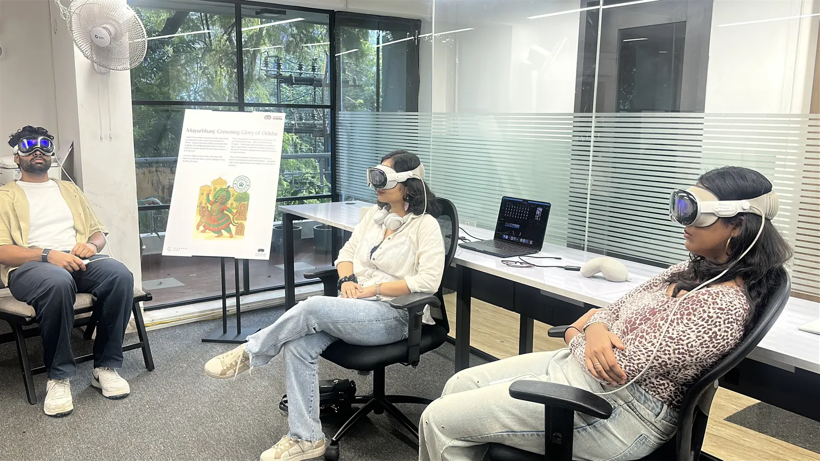 Guests wearing Apple Vision Pro headsets during a Culture Lab session, with the Mayurbhanj panel in view