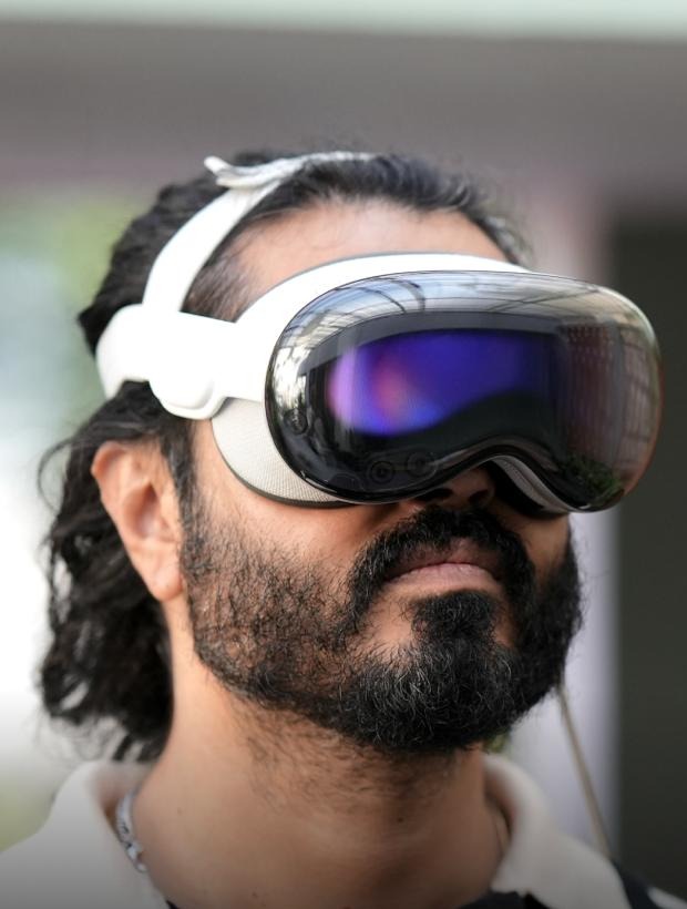 A visitor wearing Apple Vision Pro during a Culture Labs experience